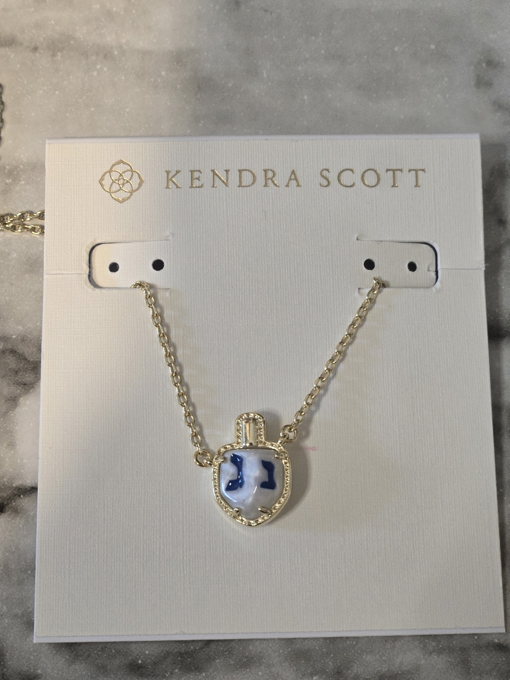 Kendra Scott  White and Blue Dreidel Pendant